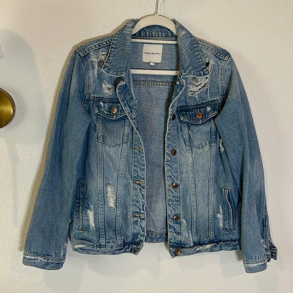 Distressed denim jacket
